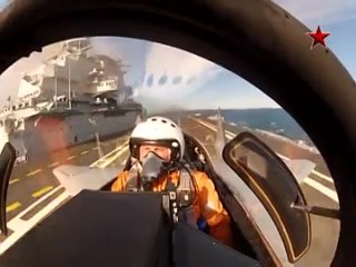 mig-29k landing on the deck of an aircraft carrier
